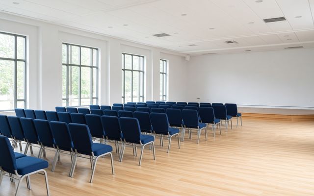 Clean community hall with chairs set up